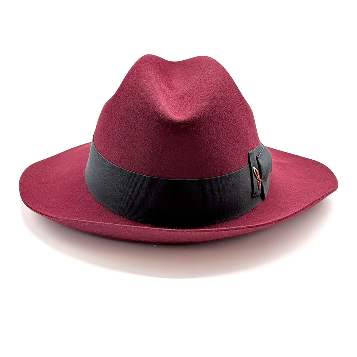 Red fedora hat with a black band on a white background