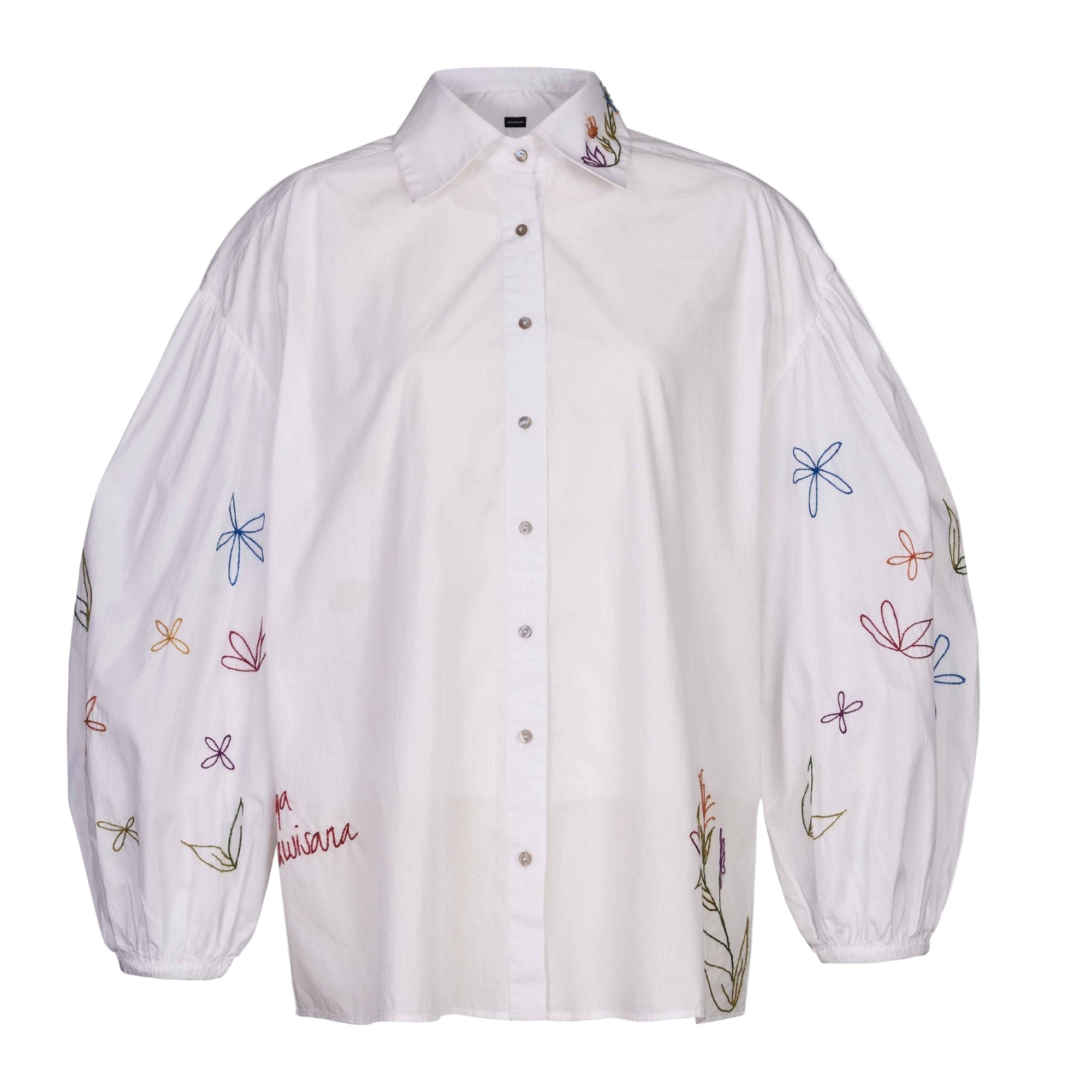 White shirt with colorful floral embroidery on a white background