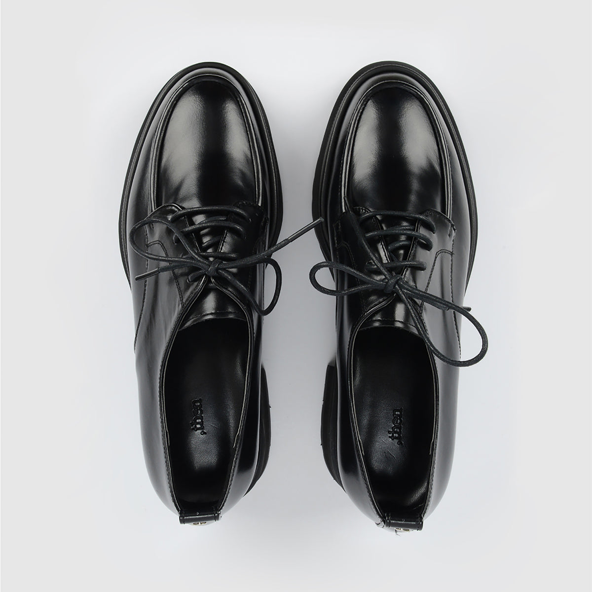 The THEN Black Chunky Leather Derby Shoes with Lug Sole are displayed side by side on a plain white background, viewed from above and expertly handcrafted in Korea.
