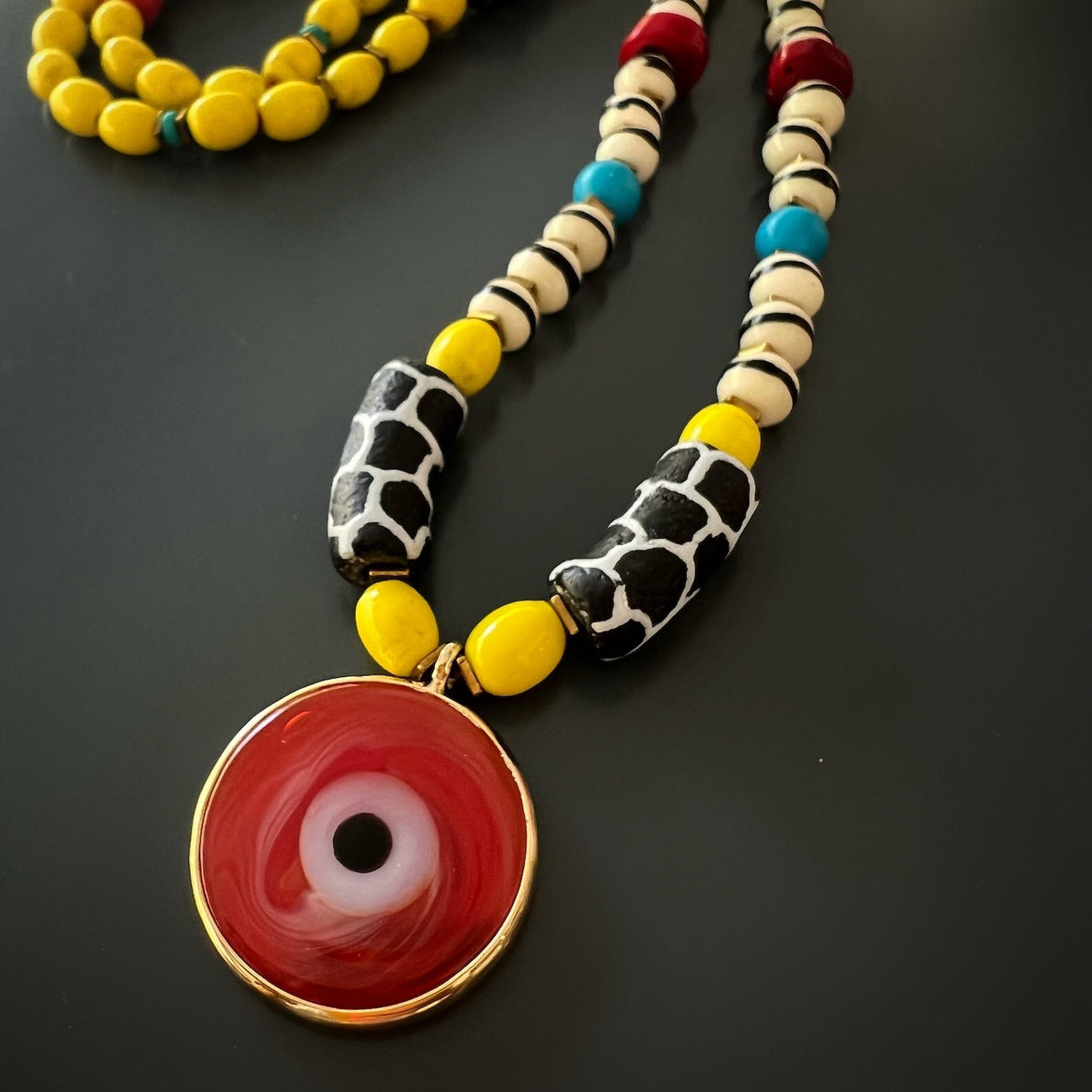 Detailed shot of the turquoise stones used in the African Yellow Happiness Necklace.