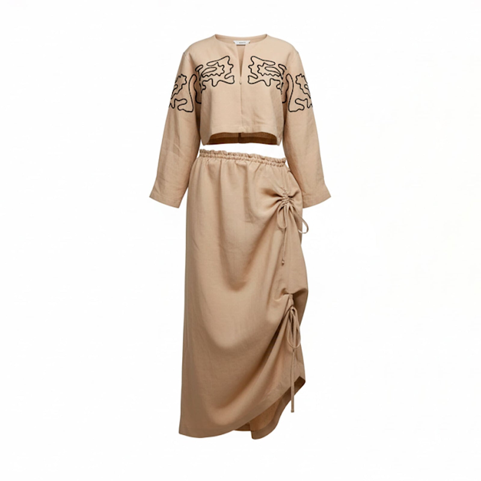 Beige outfit with embroidered top and tied skirt on a white background
