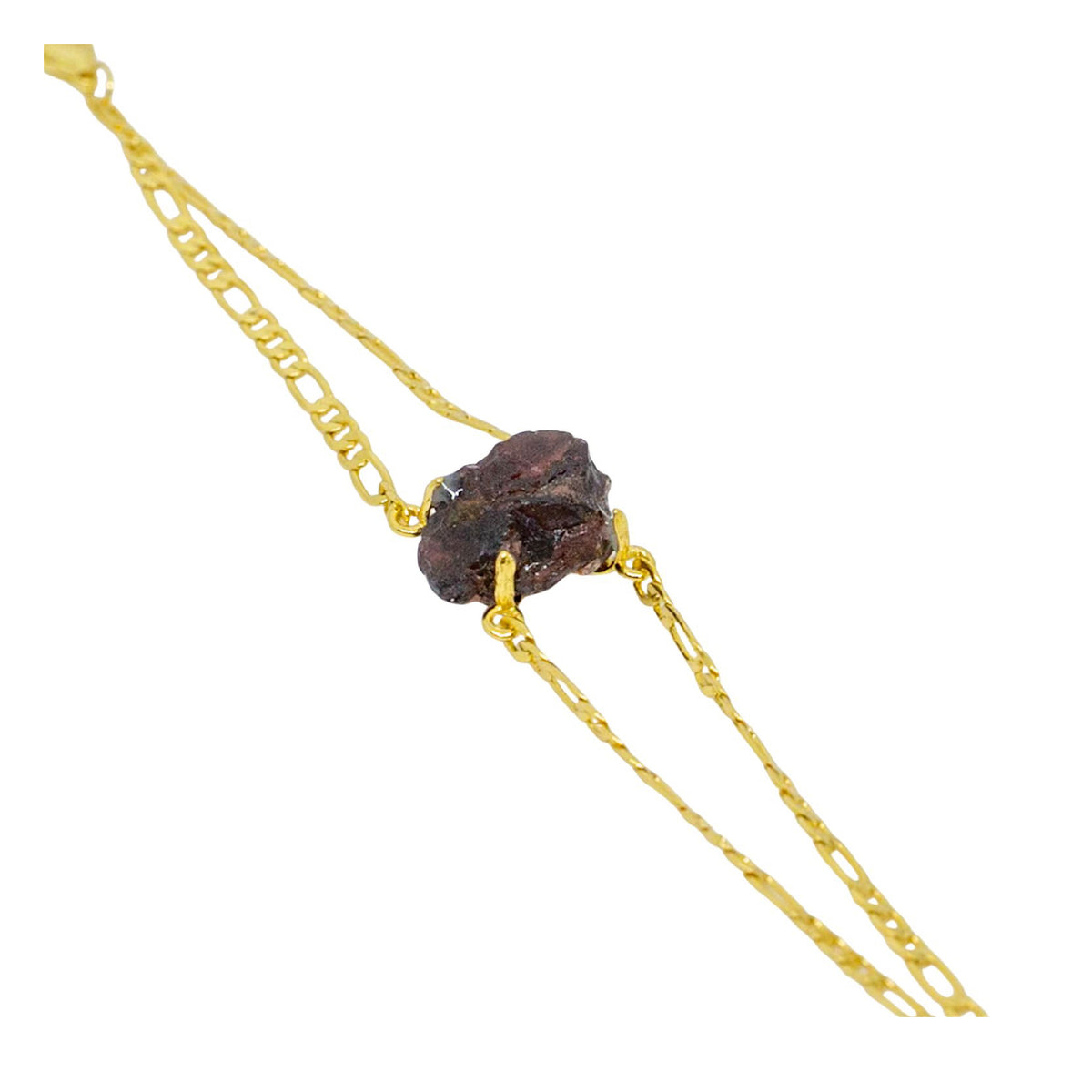 Gold chain with a dark brown stone on a white background