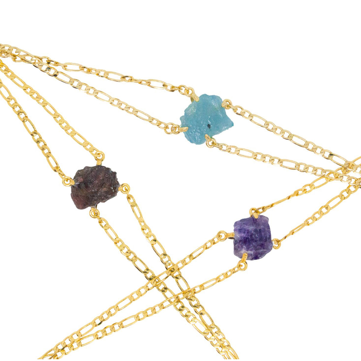 Gold chain necklaces with embedded stones on a white background