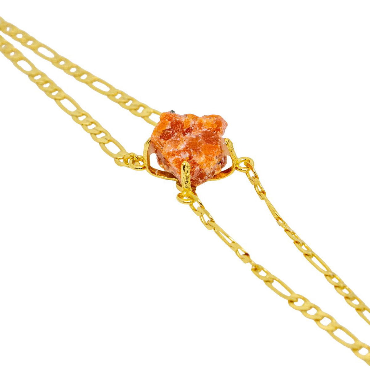 Gold chain with a natural stone pendant on a white background