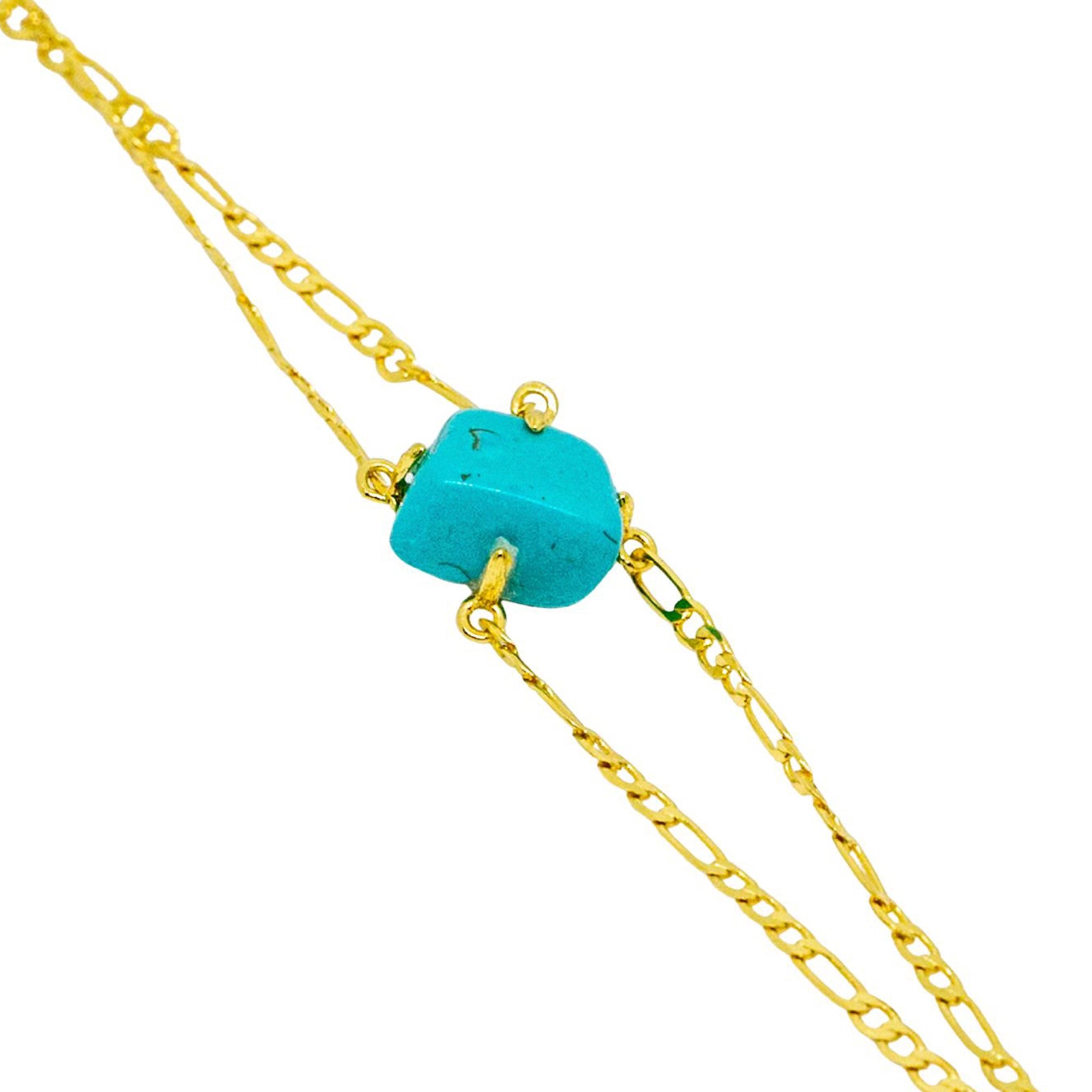 Gold chain necklace with a turquoise bead on a white background
