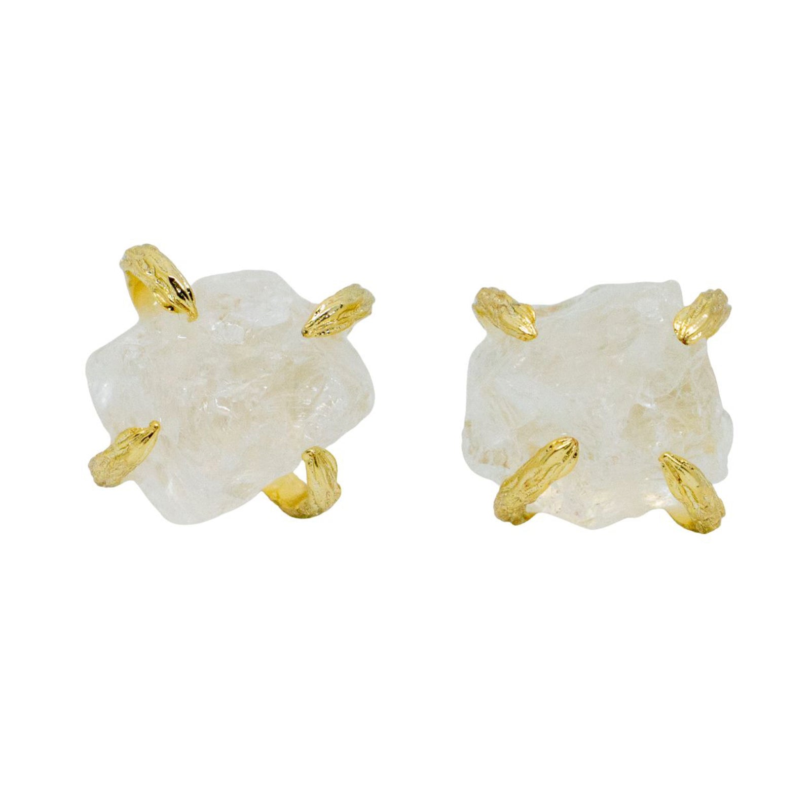 Pair of earrings with white stone and gold accents on a white background