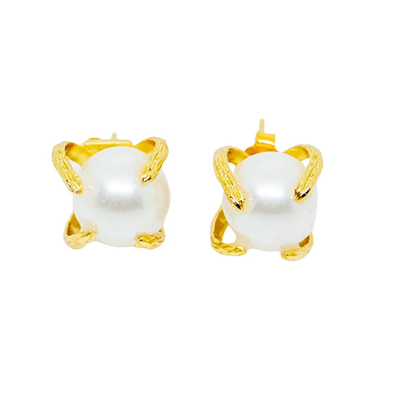 Pair of pearl earrings with gold clasps on a white background
