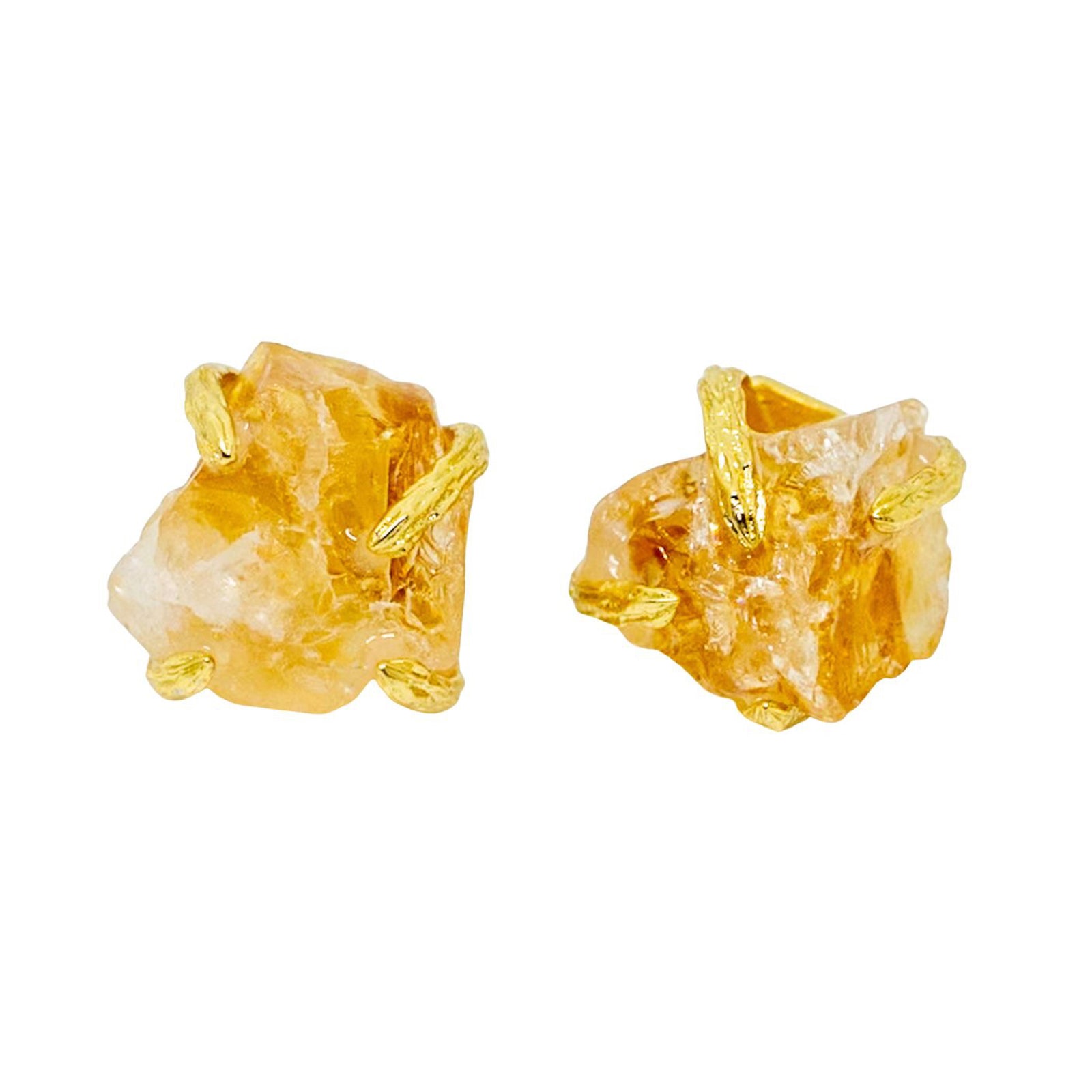 Gold and stone earrings on a white background