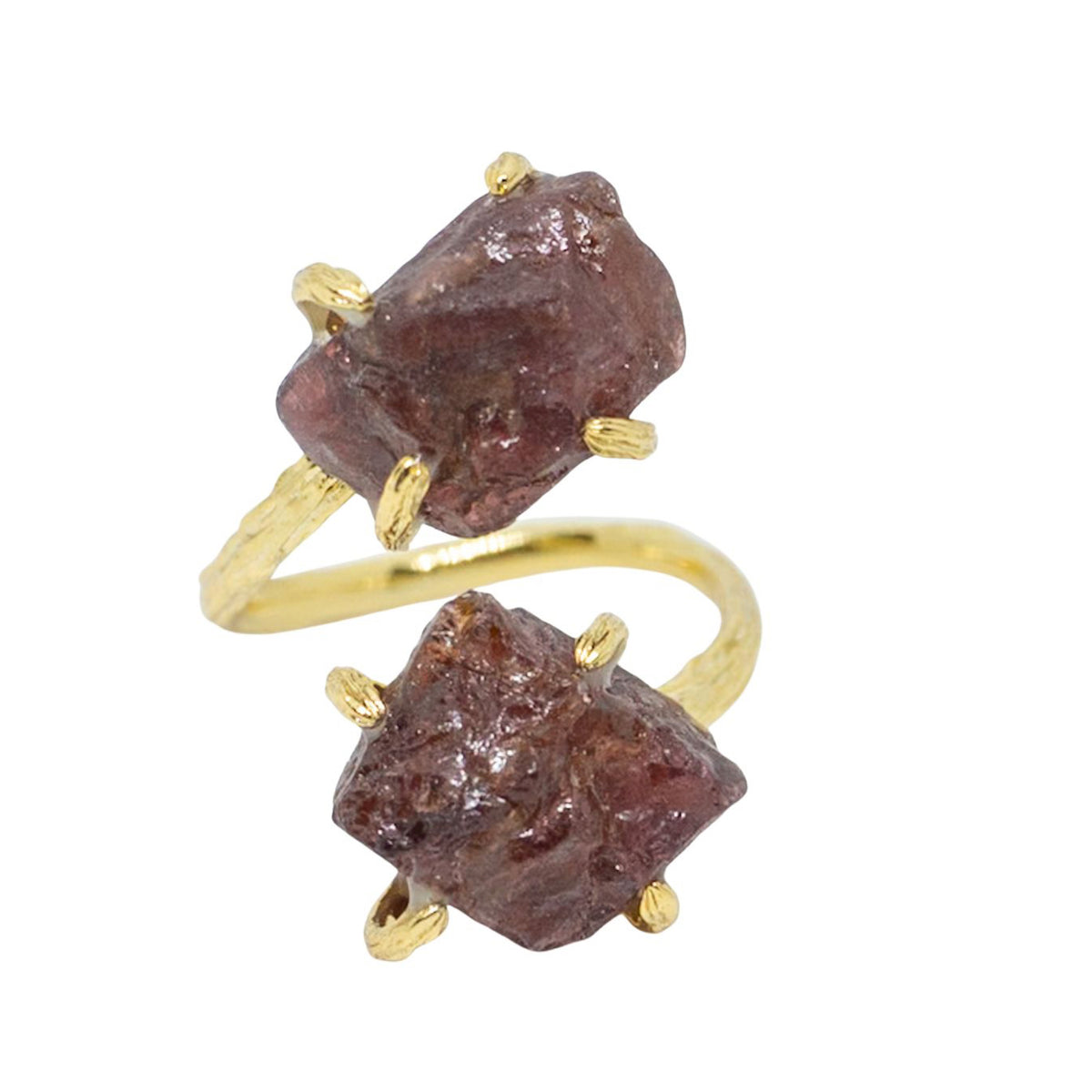 Gold ring with raw gemstones on a white background