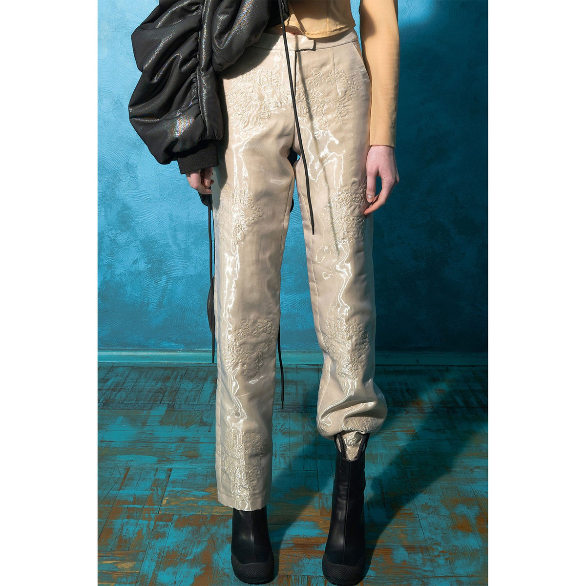 Model wearing beige padded organza straight pants