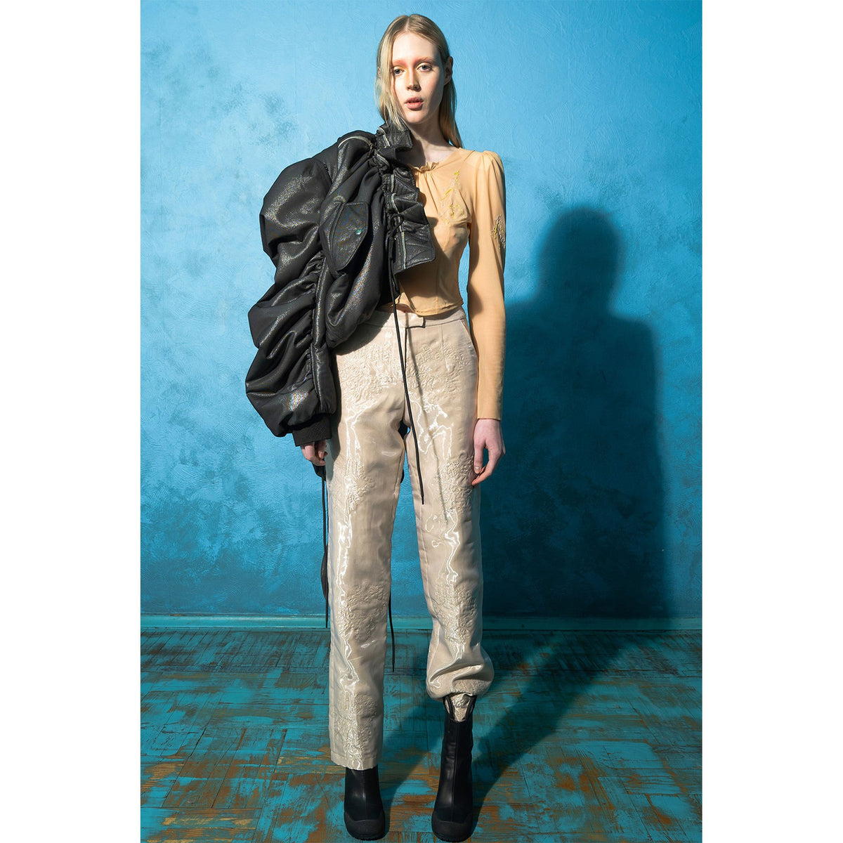 Model wearing beige padded organza straight pants