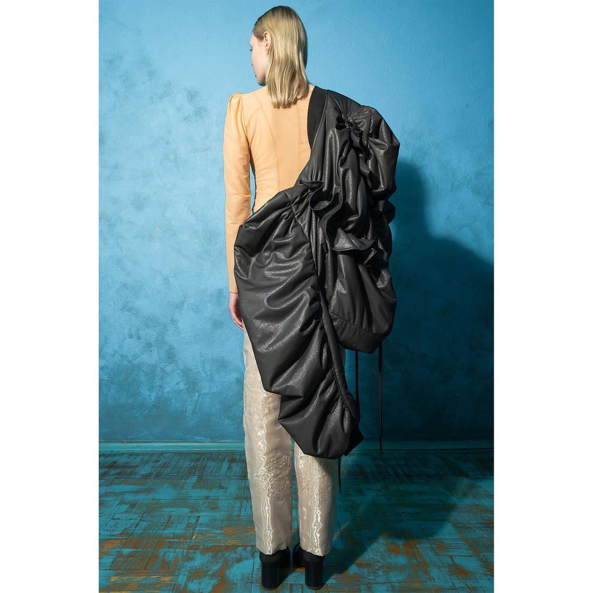 Model wearing beige padded organza straight pants