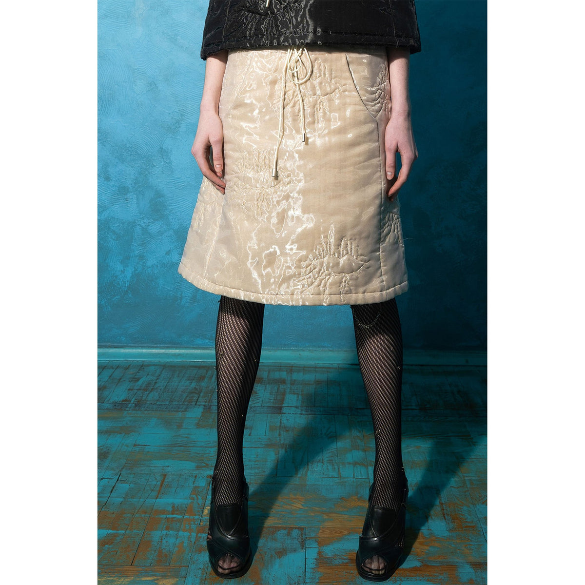 Model wearing beige padded organza trapeze skirt 