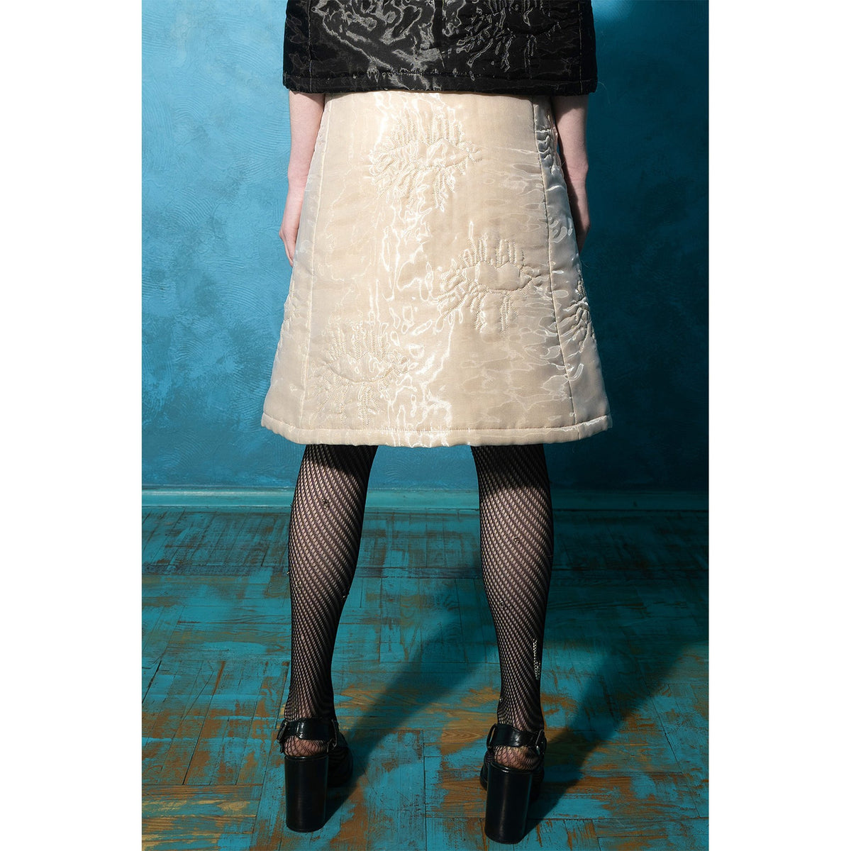 Model wearing beige padded organza trapeze skirt 