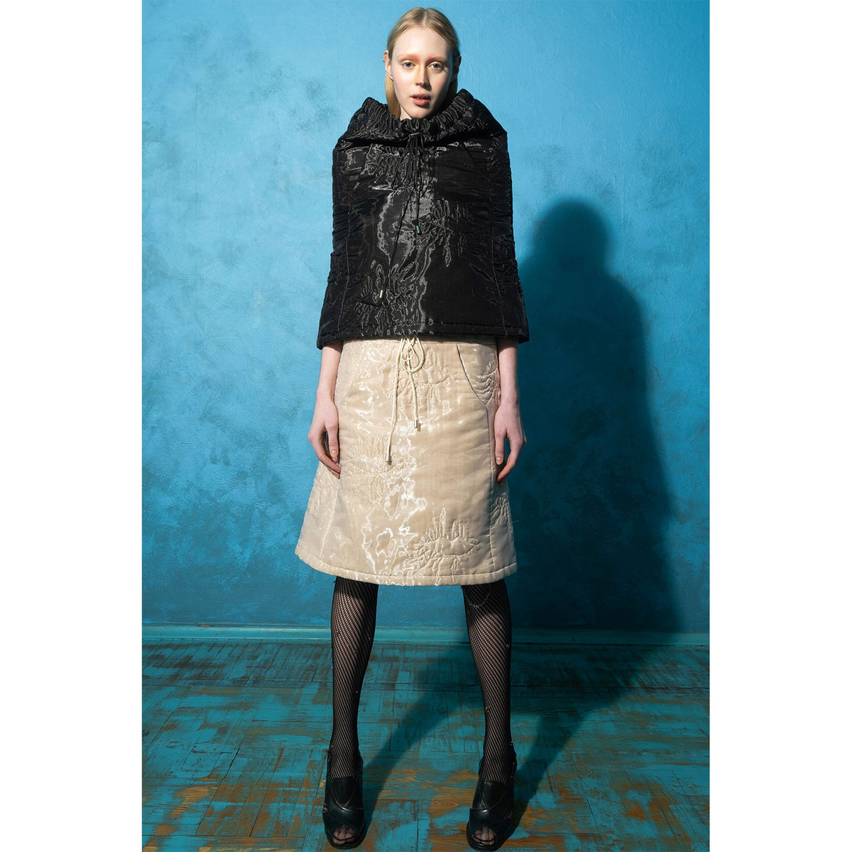 Model wearing beige padded organza trapeze skirt 