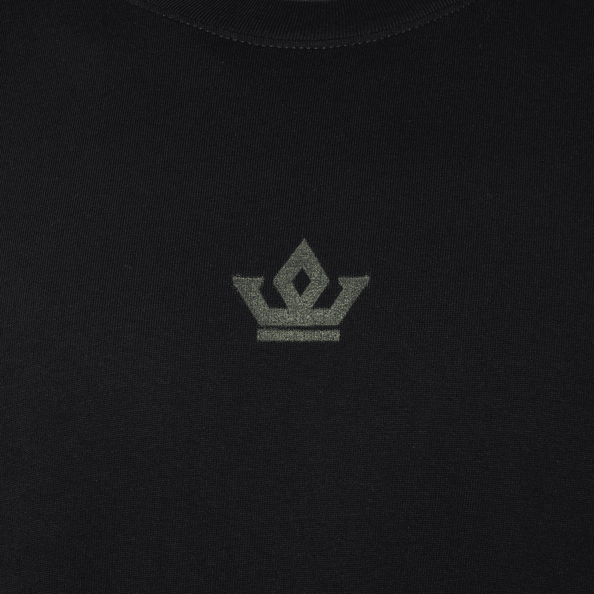 Black t-shirt with a small logo on a dark background