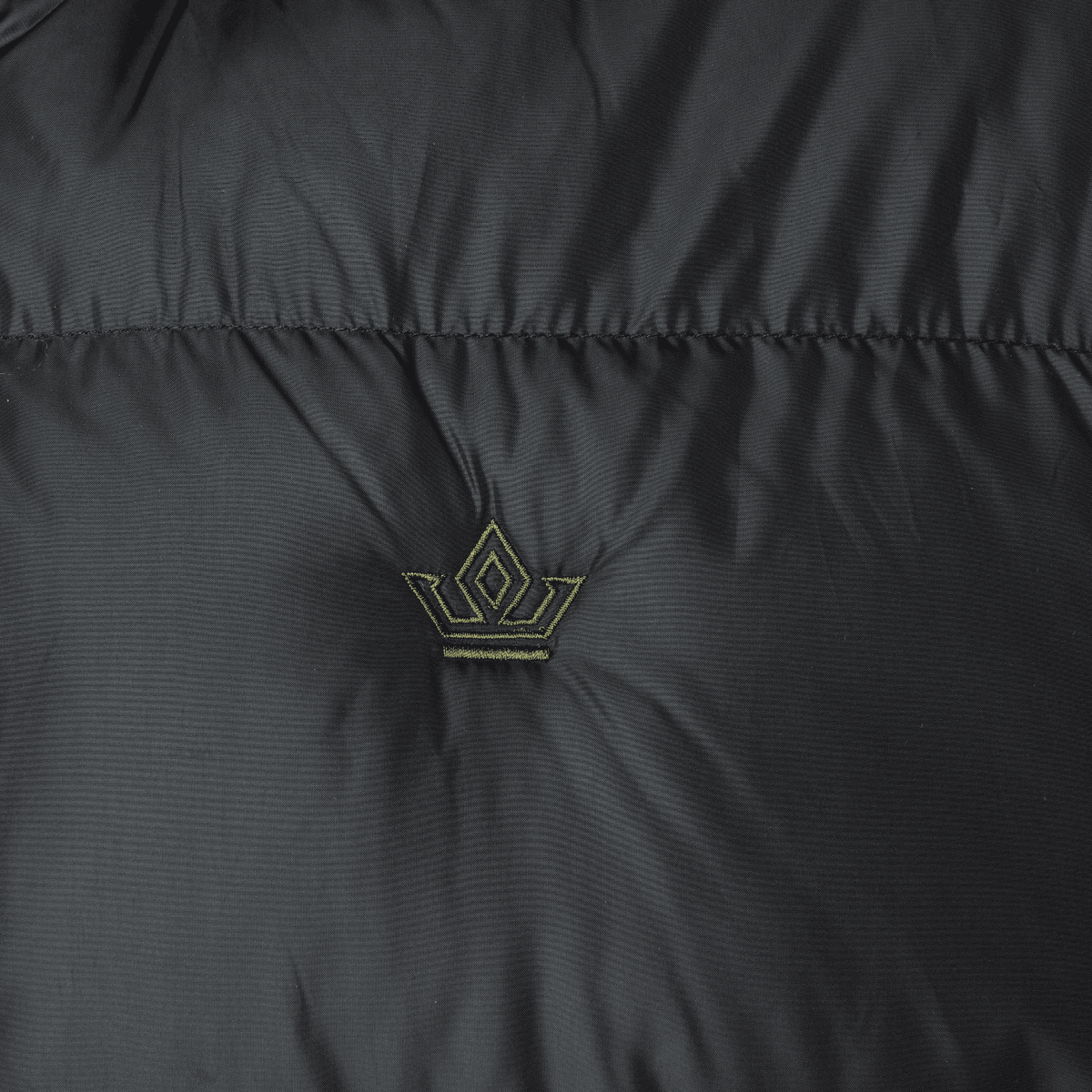 Close-up of a black jacket with a logo on the chest area.