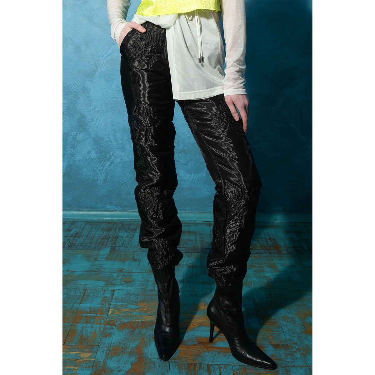 Model wearing black padded organza straight pants