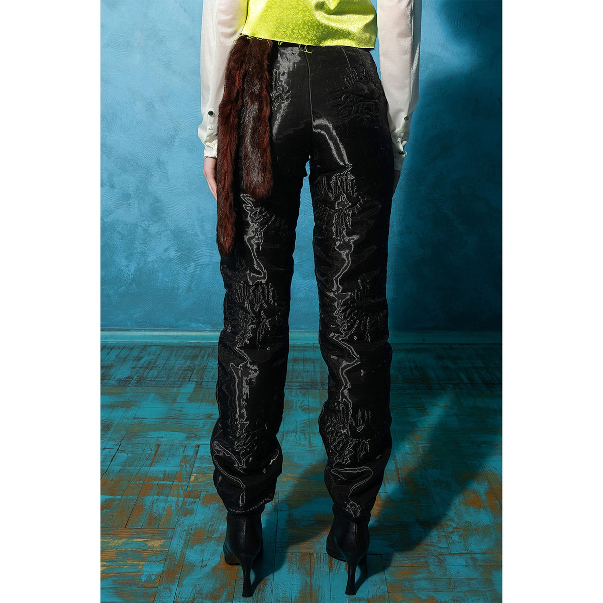 Model wearing black padded organza straight pants