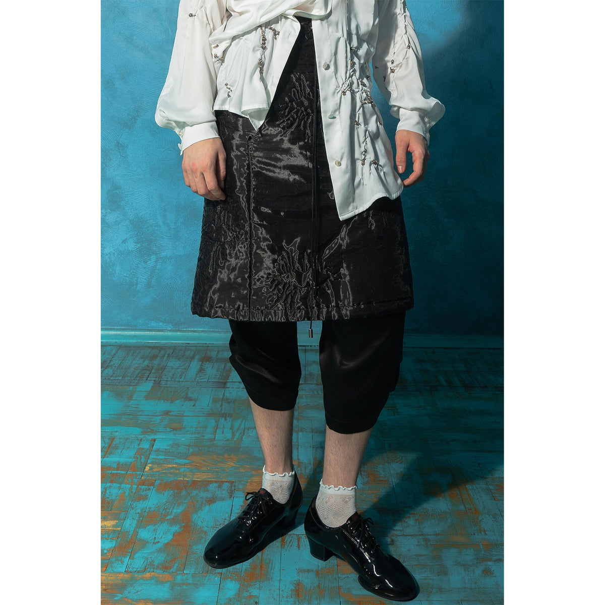 Model wearing black padded organza trapeze skirt 