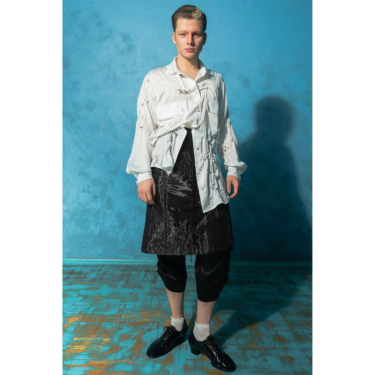 Model wearing black padded organza trapeze skirt 