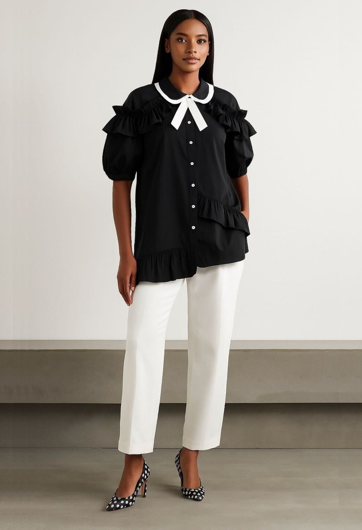 Model wearing black romantic statement asymmetric puff sleeve ruffle blouse