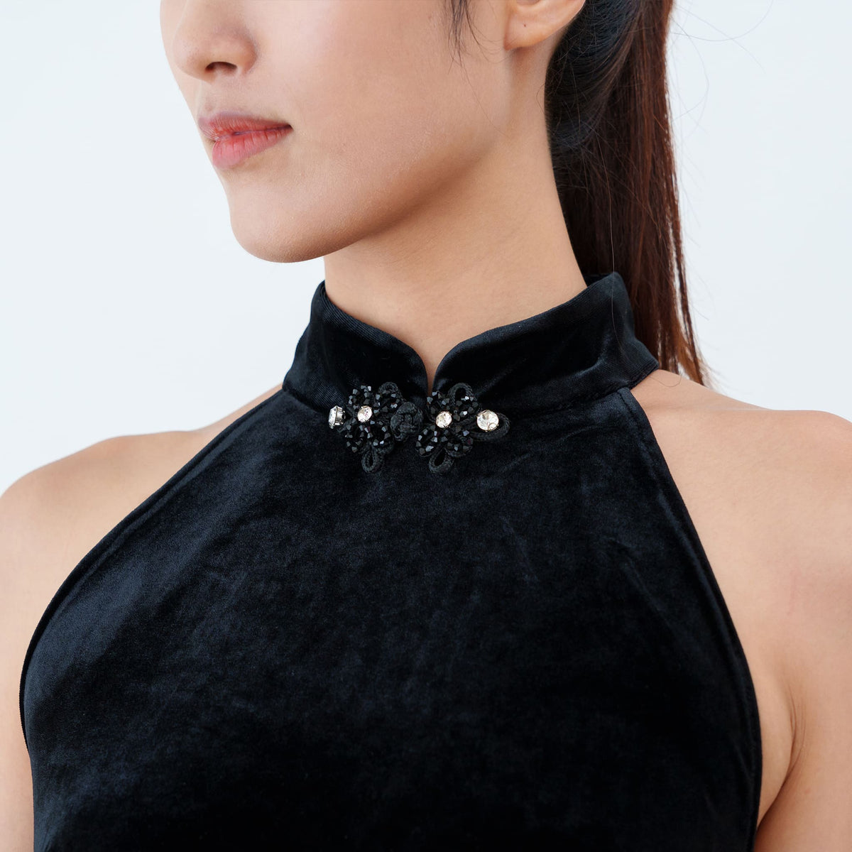 Qipology black velvet halter qipao dress with crystal-trimmed Mandarin collar and high front slit, worn by model, look 6, buy at DOORS NYC