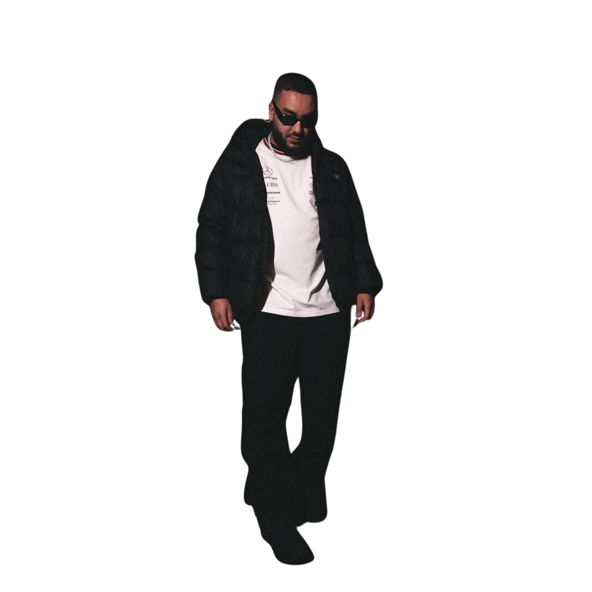 Person wearing a black jacket and pants on a white background