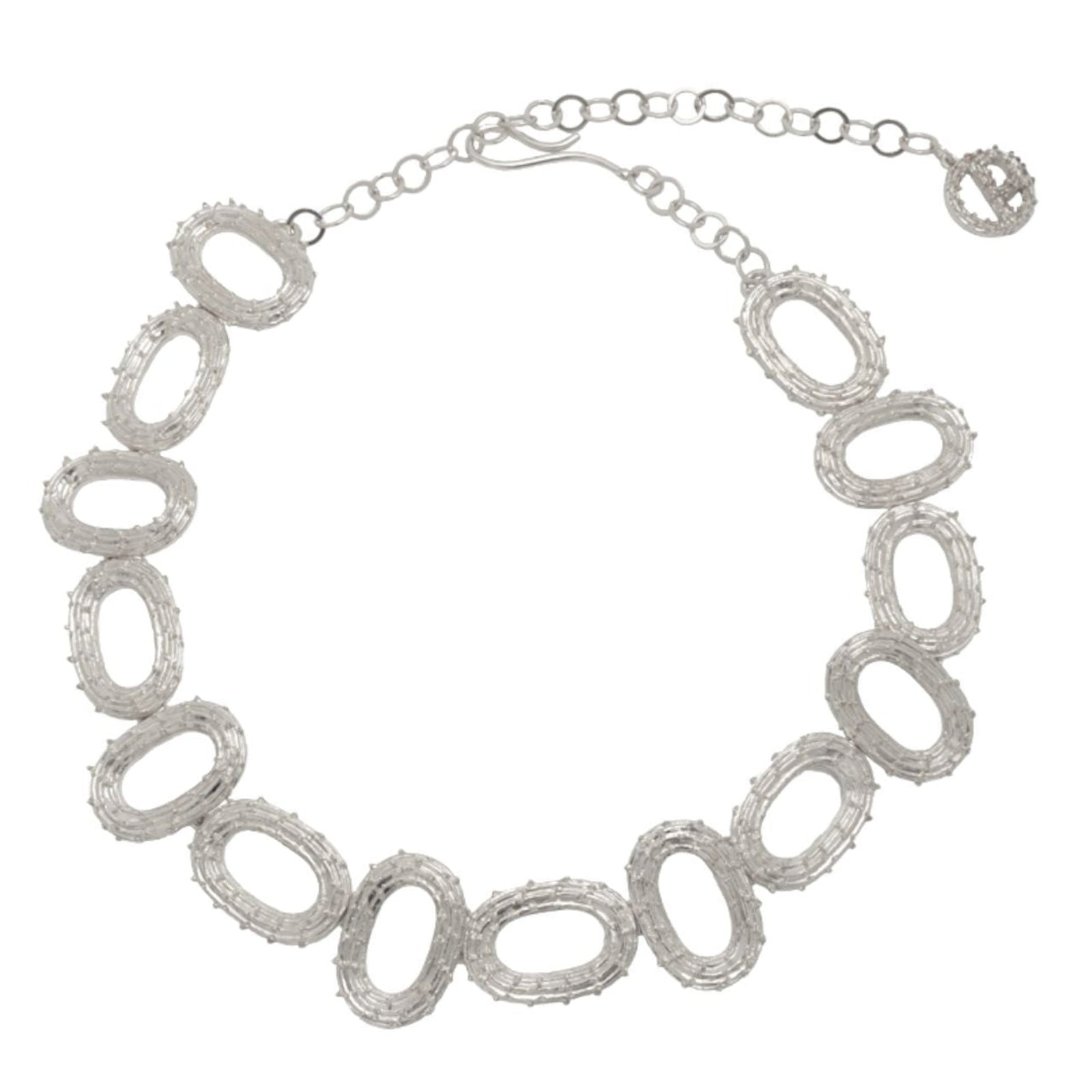 Silver necklace with oval links on a white background