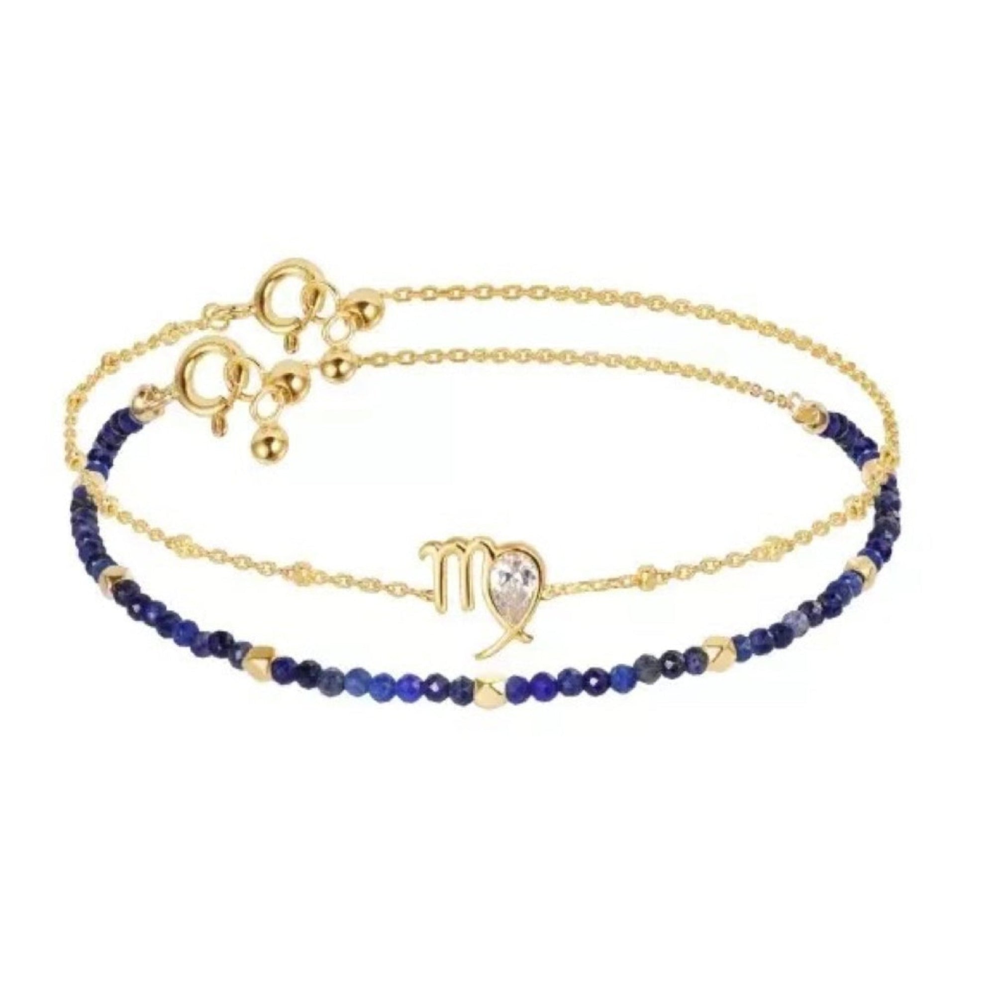 Gold bracelet with blue beaded accents on a white background