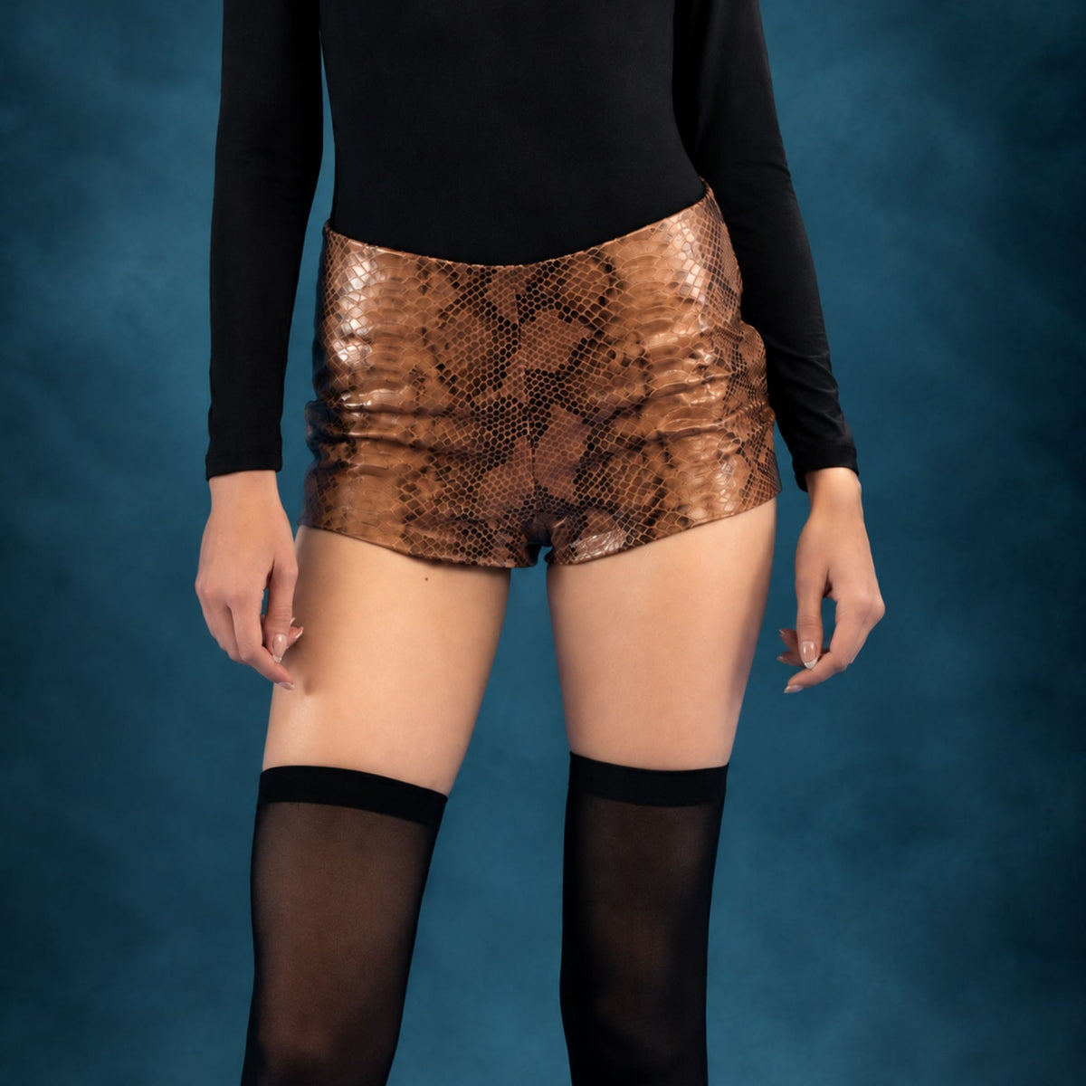HEIRA LEATHERWEAR brown snakeskin-embossed lambskin leather mini shorts, women's fitted leather shorts, worn by model, close-up, buy at DOORS NYC