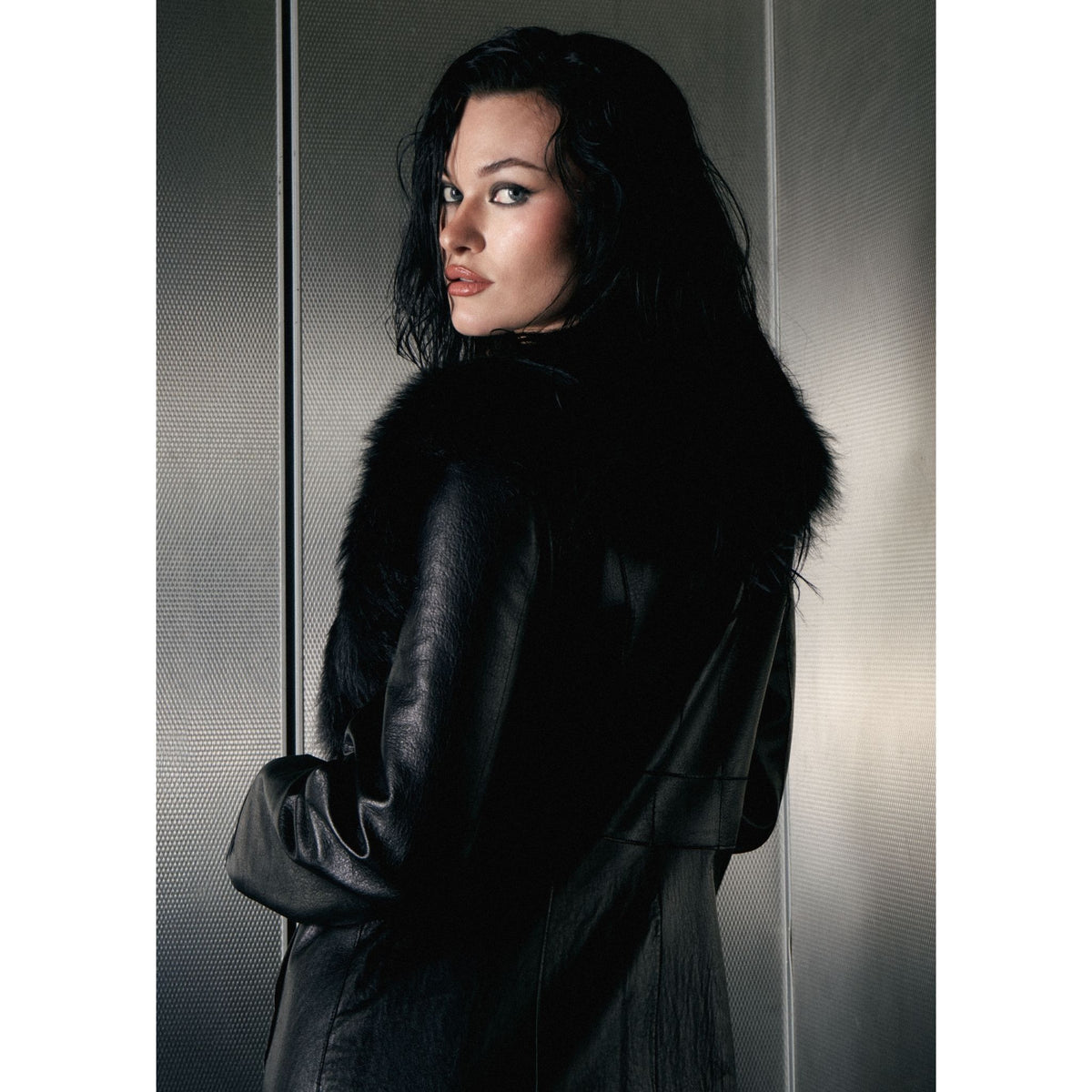HEIRA LEATHERWEAR black lambskin leather full-length trench coat with lamb fur collar, women's belted leather coat, worn by model, close-up, buy at DOORS NYC