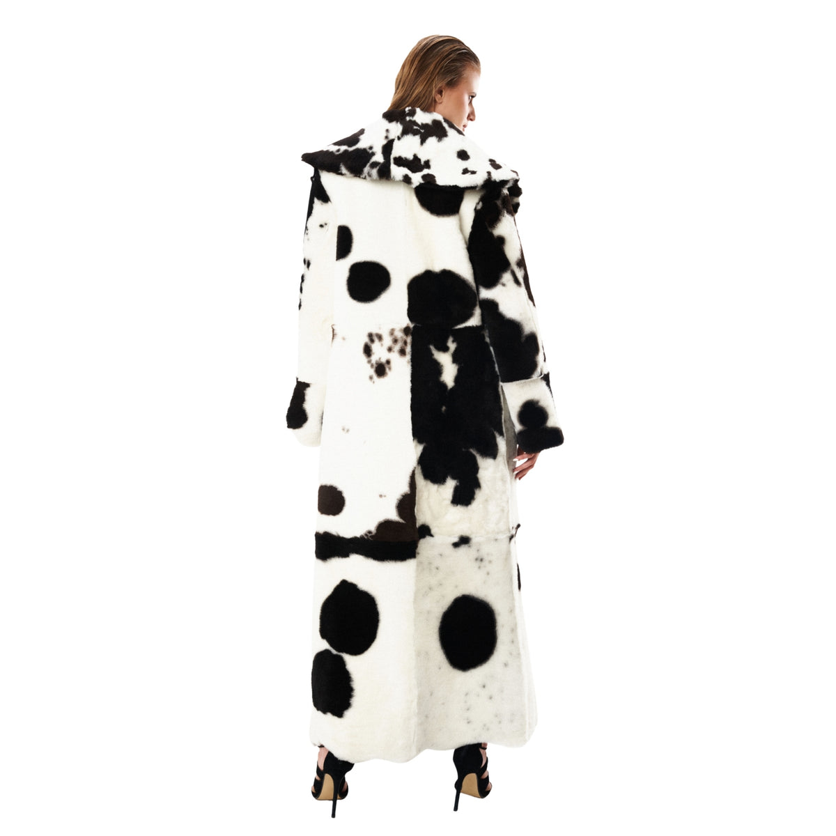 HEIRA LEATHERWEAR black and white reversible lamb shearling full-length coat, women's statement leather coat, worn by model, back view, buy at DOORS NYC