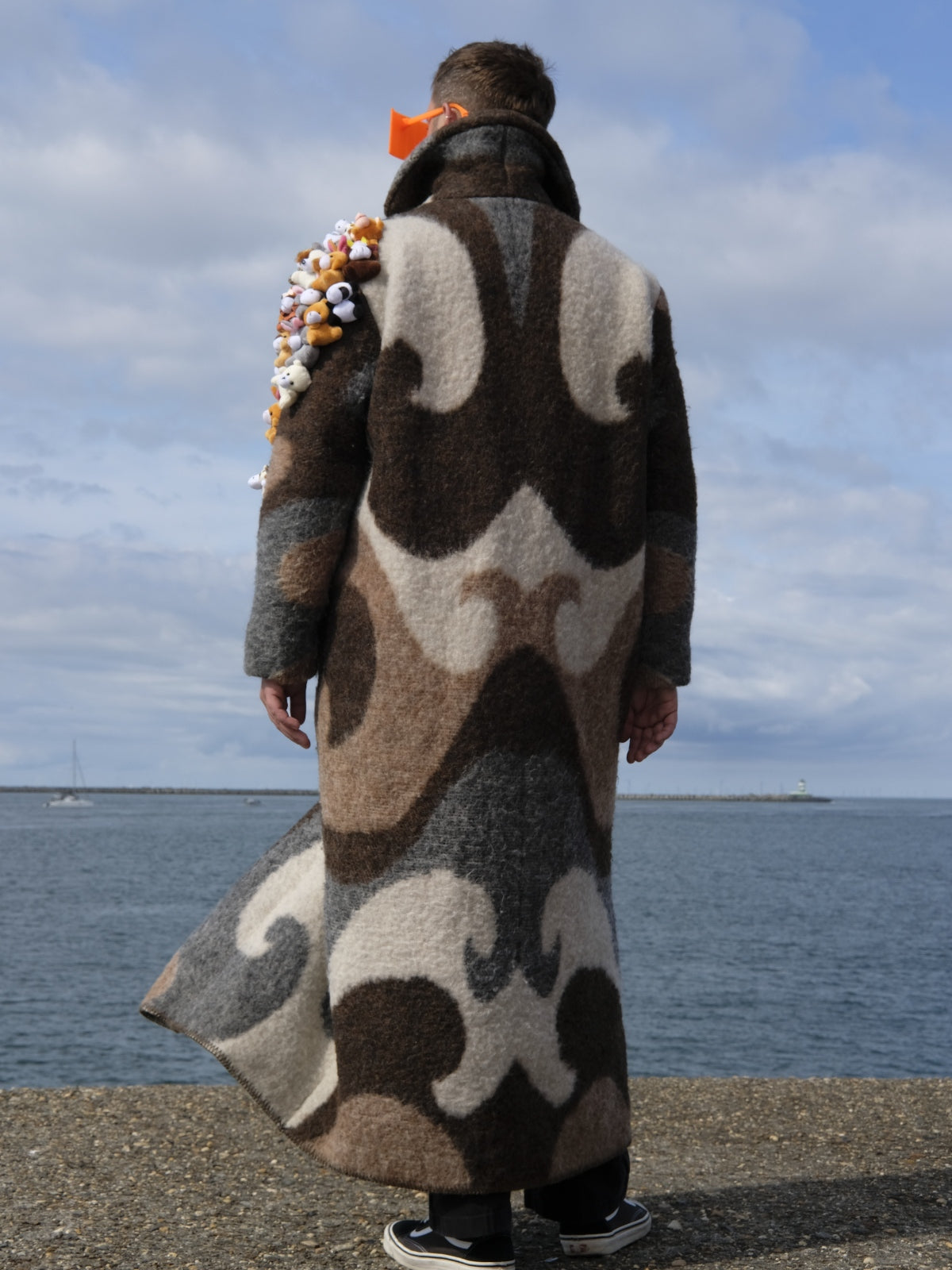 STUDIO WUNDERBAR Brown Cuddly Shoulder Coat: brown and cream retro swirl long coat with plush toys on the shoulder, upcycled one-of-a-kind coat, worn by model, buy at DOORS NYC