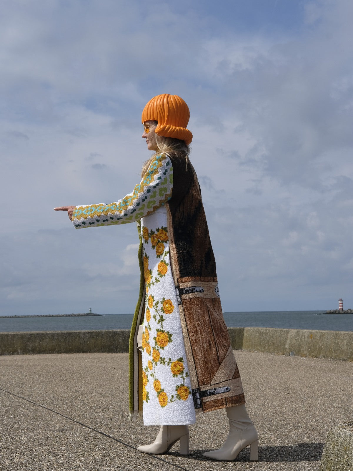 STUDIO WUNDERBAR Hella Horse Coat: blue floral patchwork long coat with yellow roses, striped panels, fringe hem and a horse panel on the back, upcycled one-of-a-kind coat, worn by model, buy at DOORS NYC
