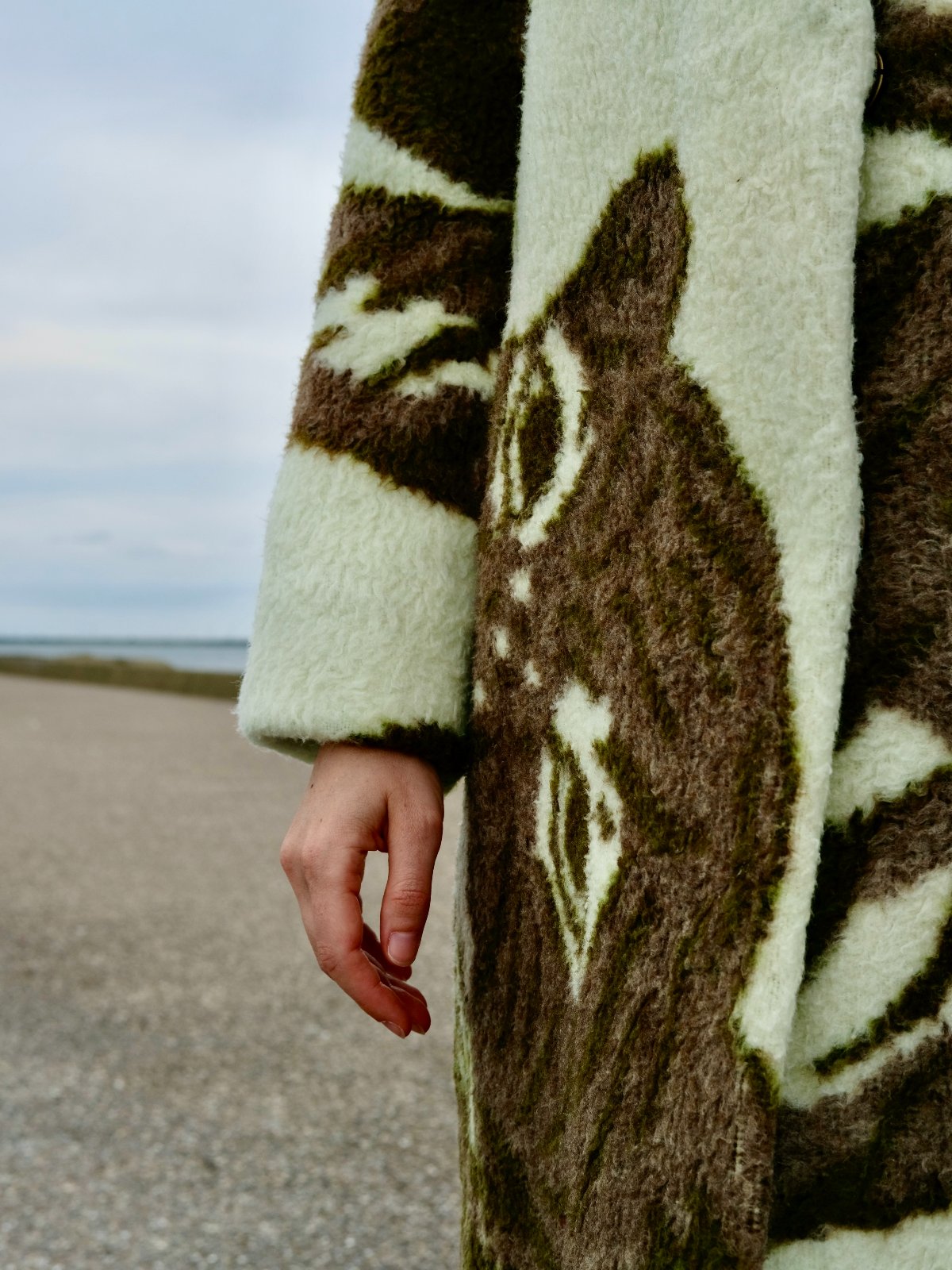STUDIO WUNDERBAR Greenish Tiger Coat: cream and olive green teddy long coat with botanical and tiger pattern in chocolate brown, moss green and ivory, upcycled one-of-a-kind coat, close-up detail, buy at DOORS NYC