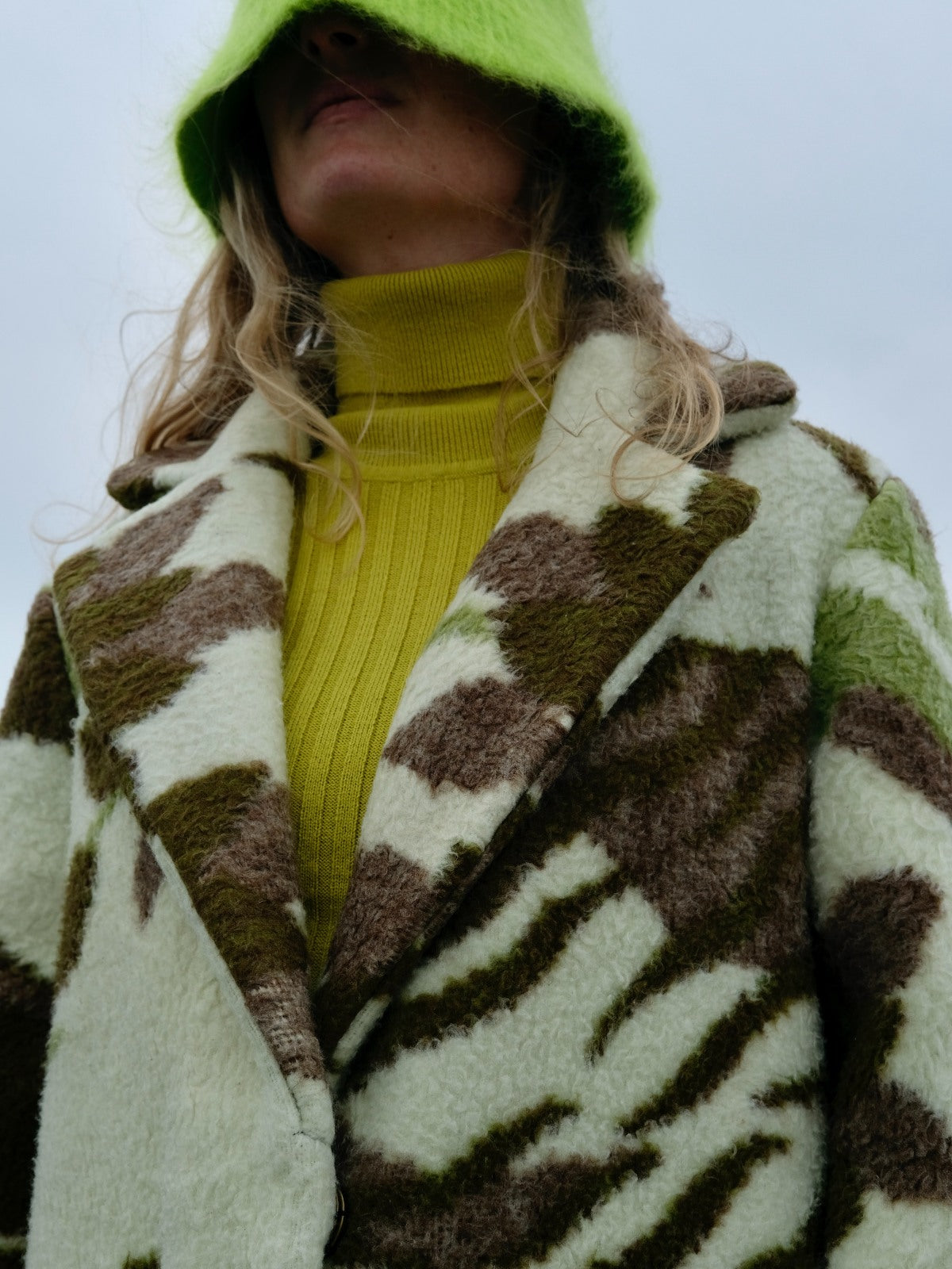 STUDIO WUNDERBAR Greenish Tiger Coat: cream and olive green teddy long coat with botanical and tiger pattern in chocolate brown, moss green and ivory, upcycled one-of-a-kind coat, worn by model, buy at DOORS NYC