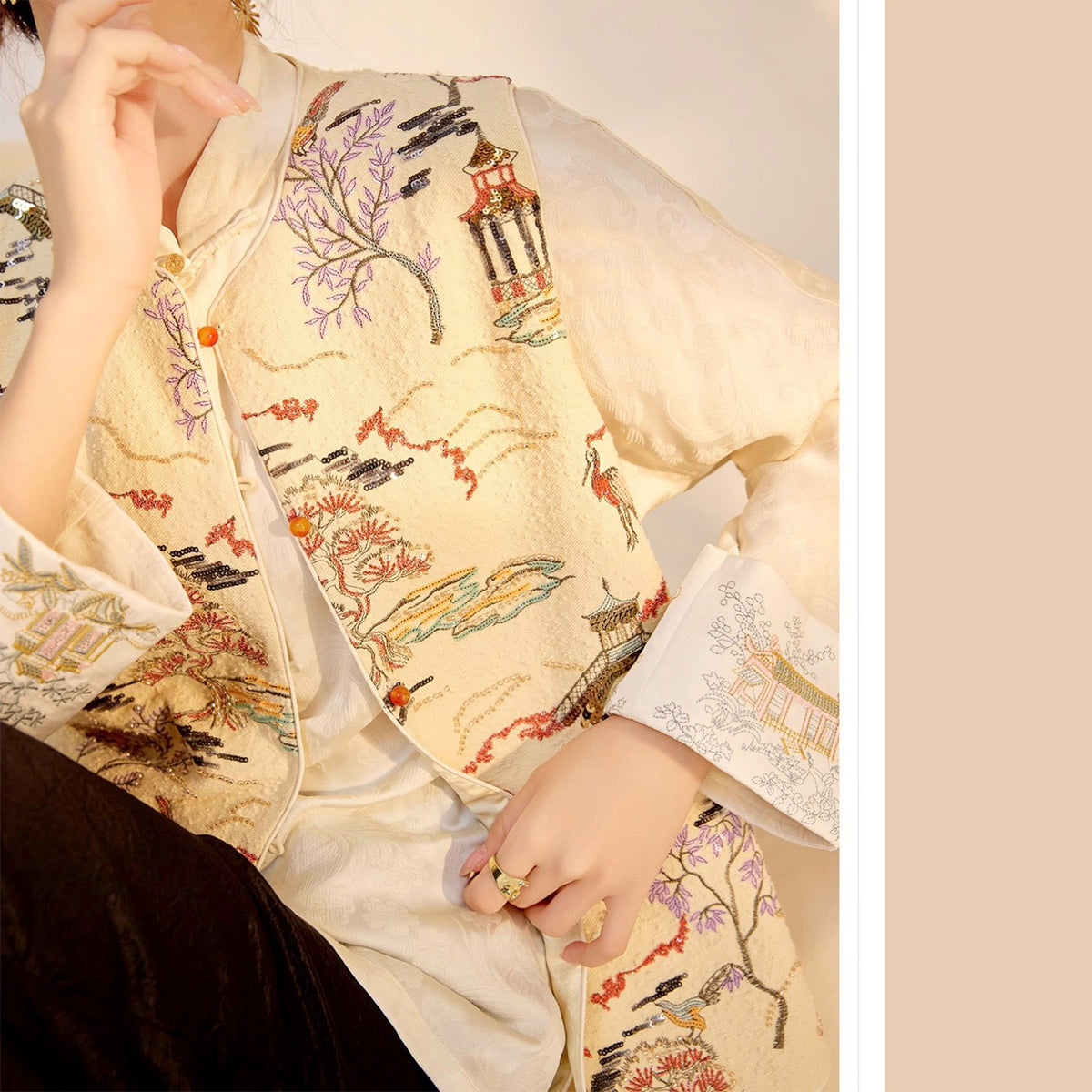 Traditional embroidered garment with intricate patterns on a plain background