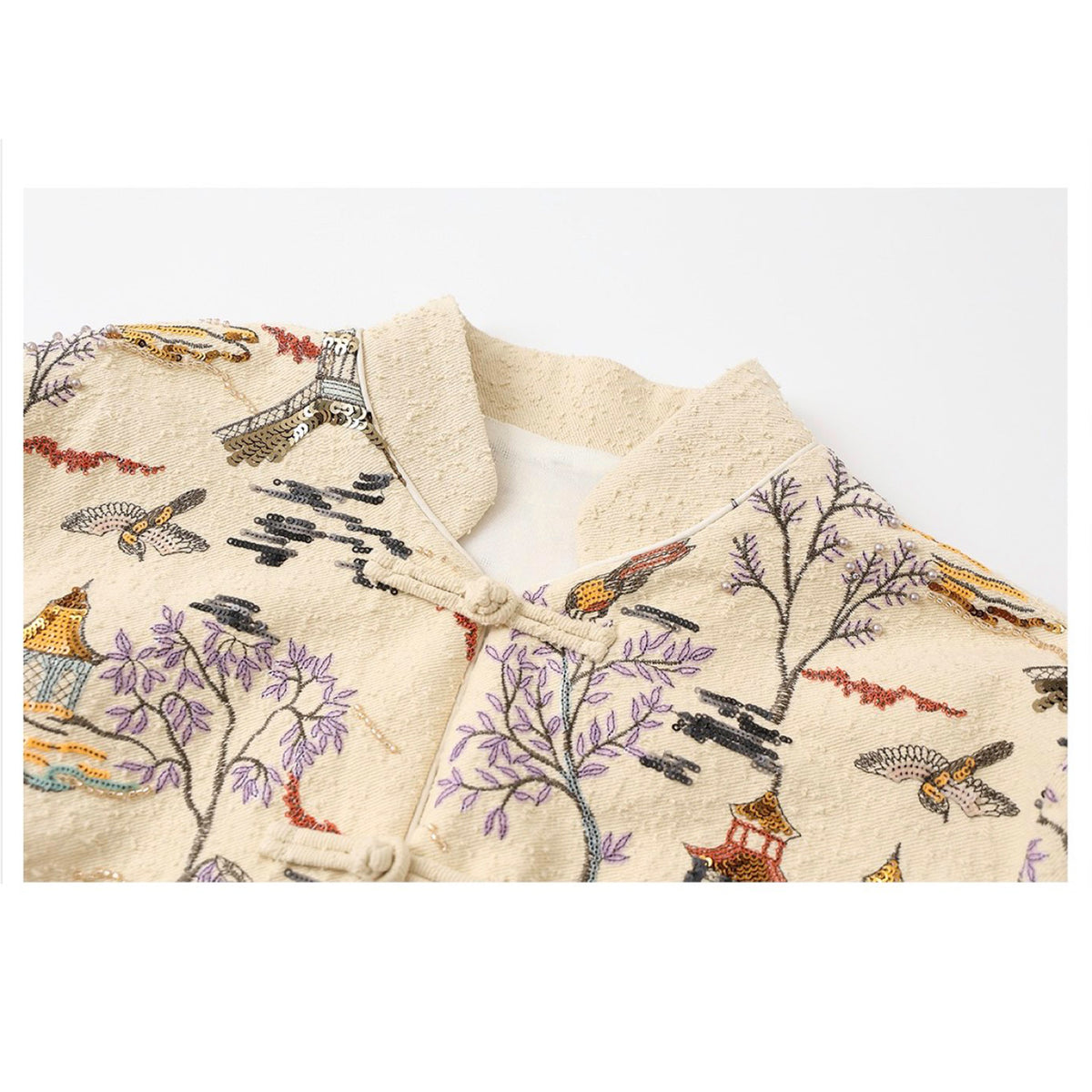 Textile with bird and tree pattern on a white background