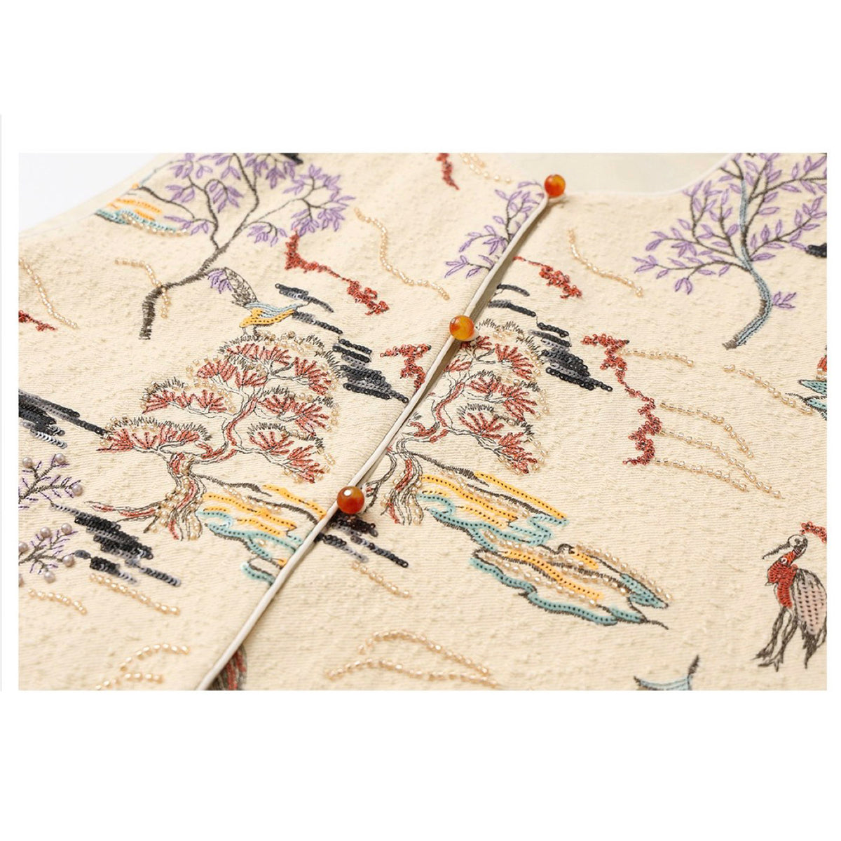 Embroidered fabric with floral patterns on a beige background