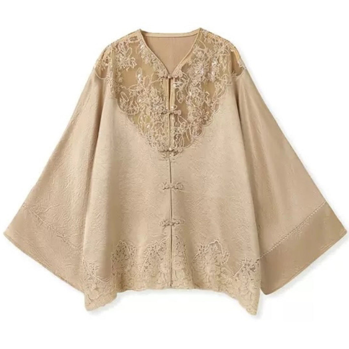 Beige cape with lace detailing on a white background