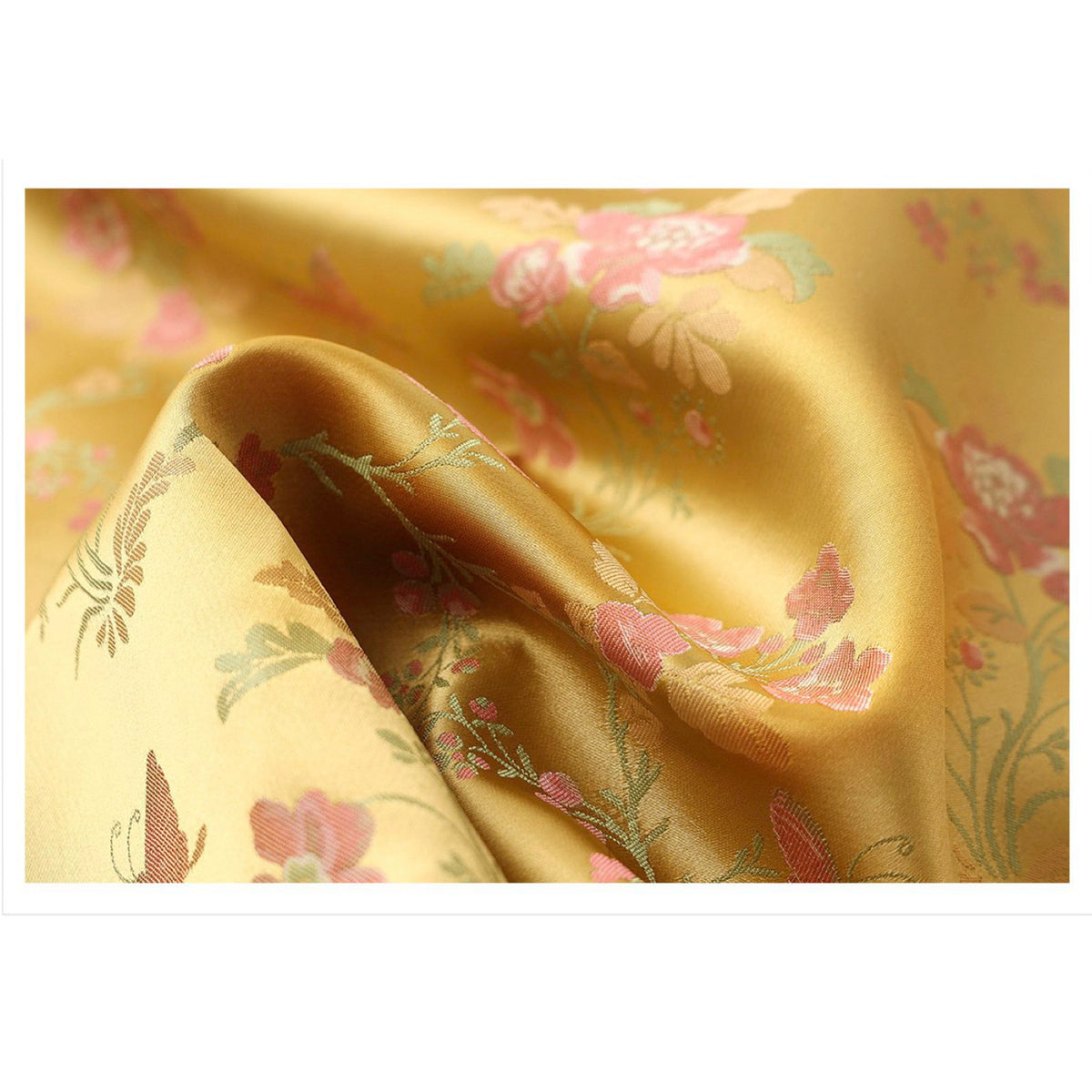 Yellow fabric with floral patterns on a white background