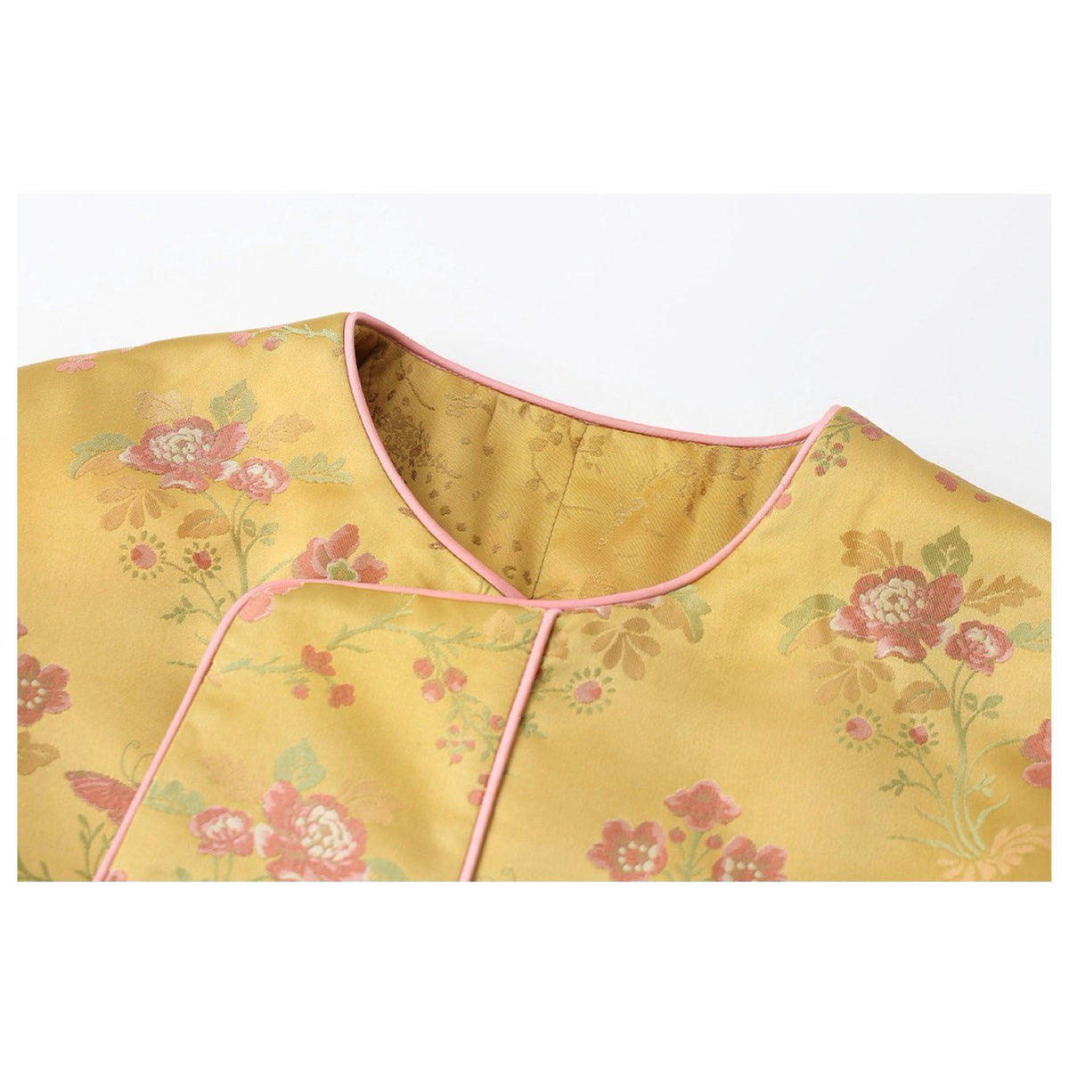 Green floral patterned garment on a white background