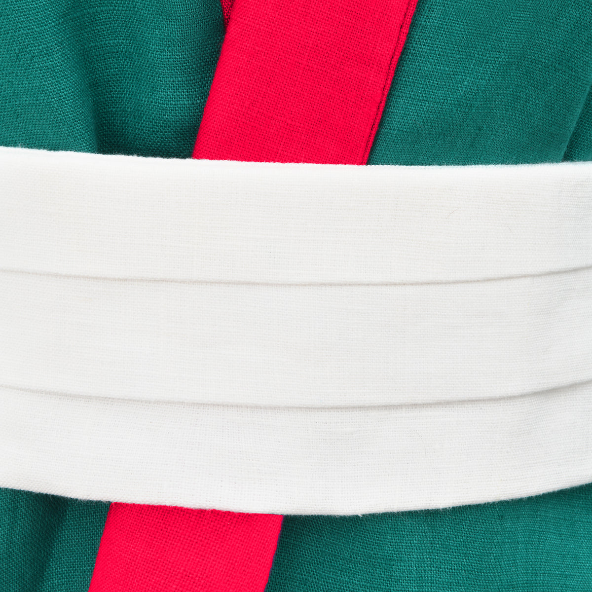 Close-up of a fabric with green, red, and white stripes.