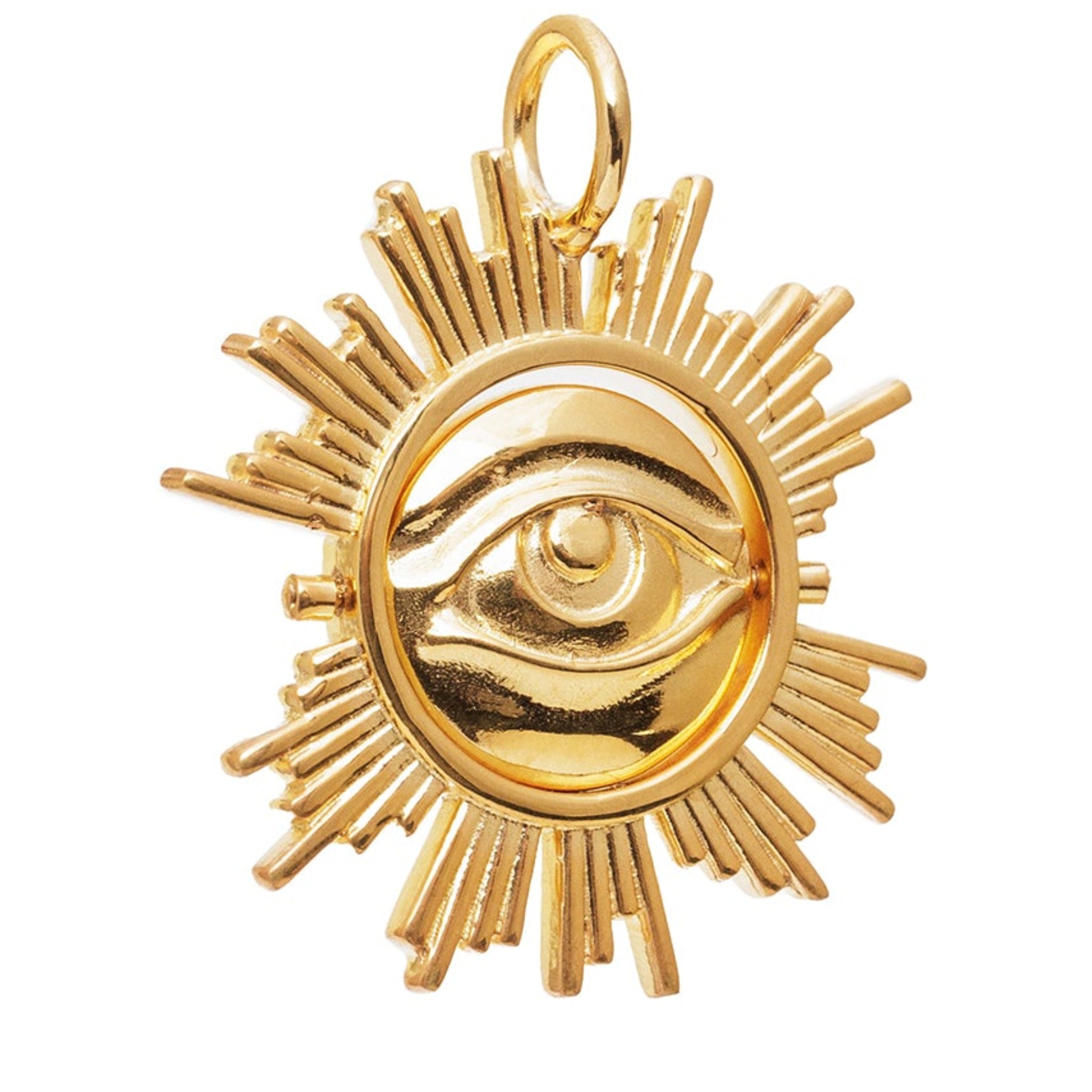 Gold pendant with eye design on a white background