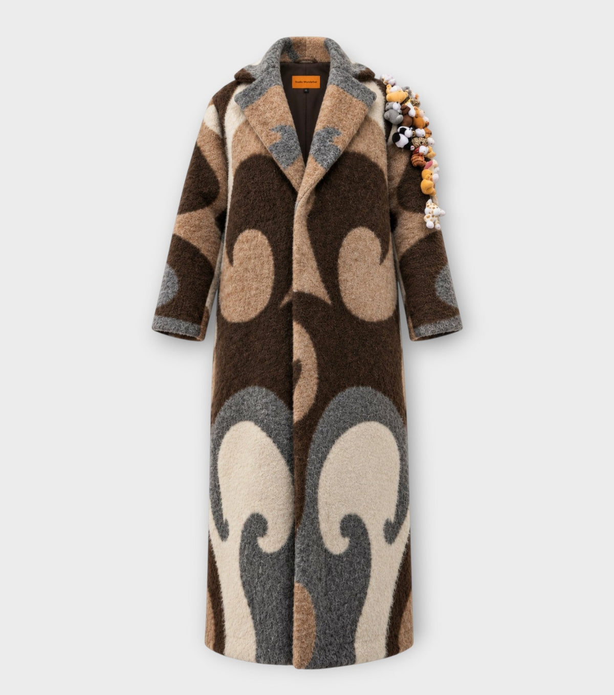 STUDIO WUNDERBAR Brown Cuddly Shoulder Coat: brown and cream retro swirl long coat with plush toys on the shoulder, upcycled one-of-a-kind coat, product photo, buy at DOORS NYC