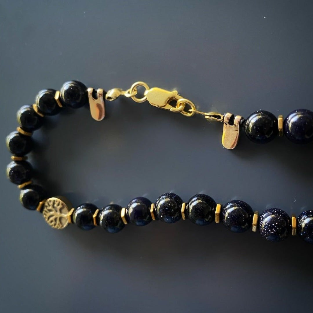 Elegant Gold Hematite Tree of Life Necklace featuring a Handcrafted Isis Pendant, a beautiful and spiritual adornment.