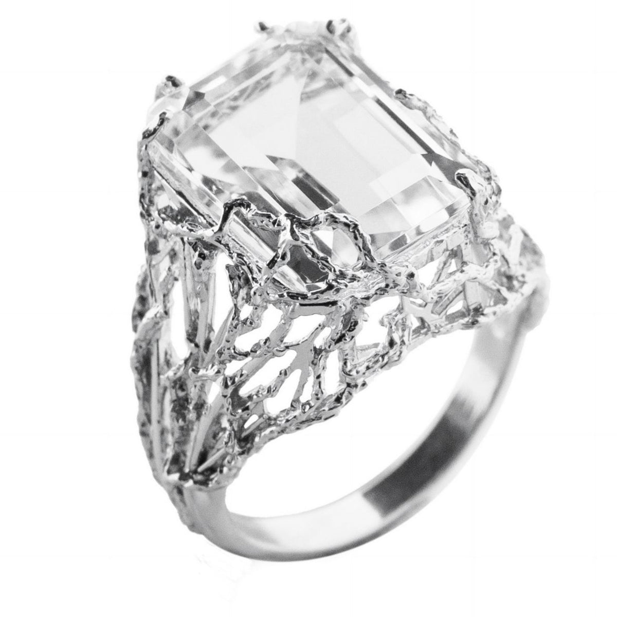 Silver ring with a large rectangular diamond on a white background