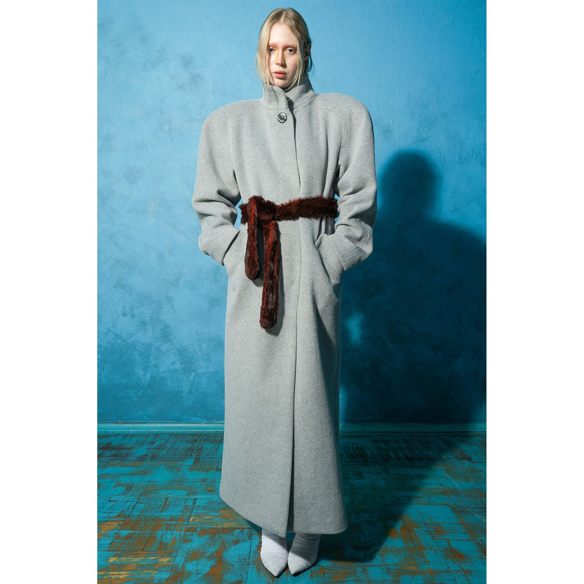 Model wearing grey wool-blend maxi coat with vintage buttons by MASHAT