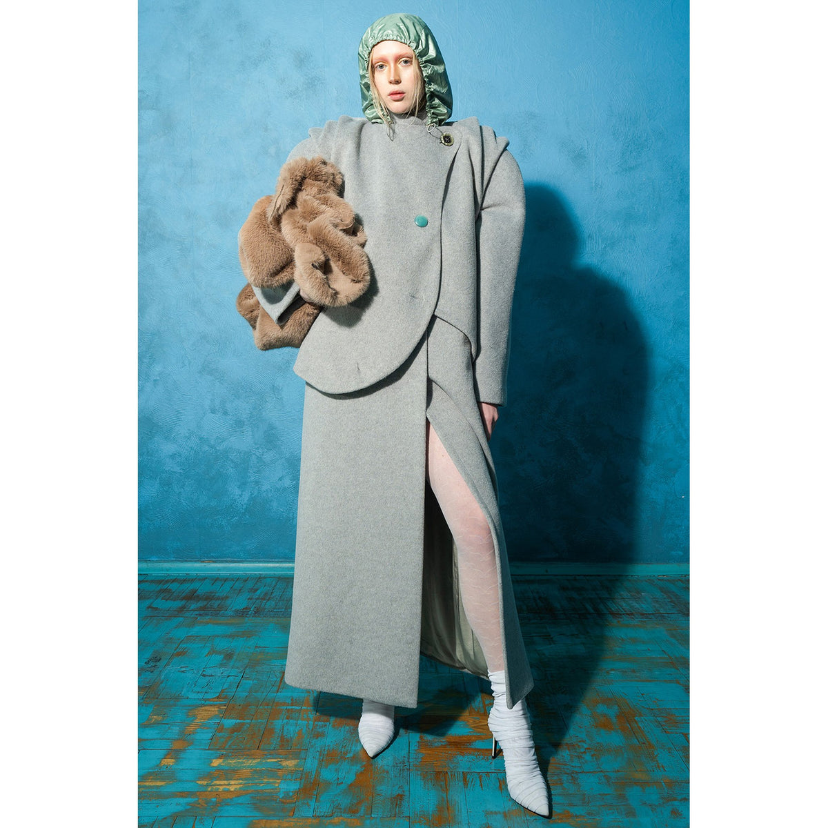 Model wearing grey wool-blend maxi coat with vintage buttons by MASHAT